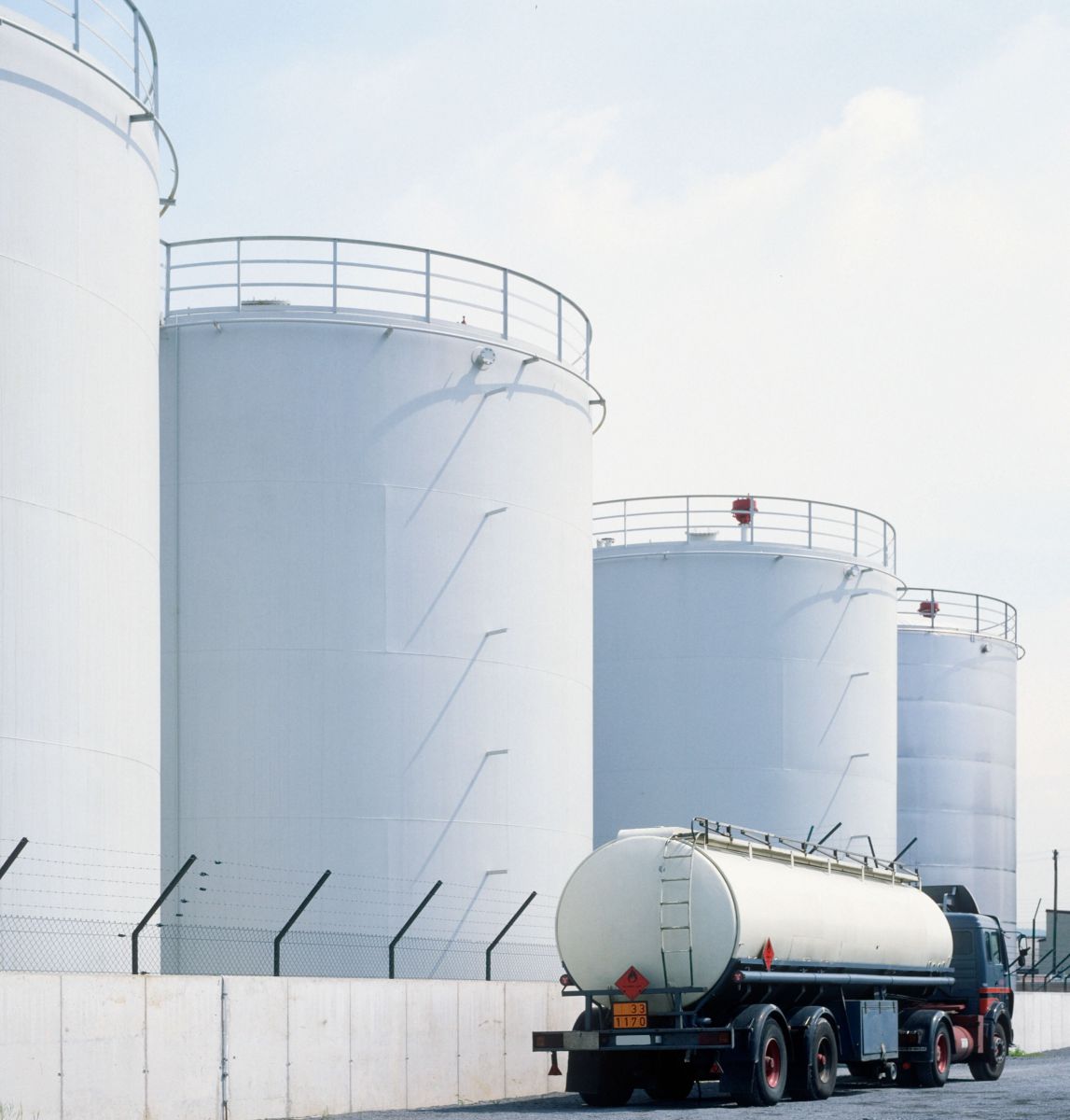 Tanker truck driving by fuel supply terminals