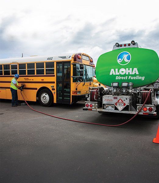 Tanker truck fueling school bus