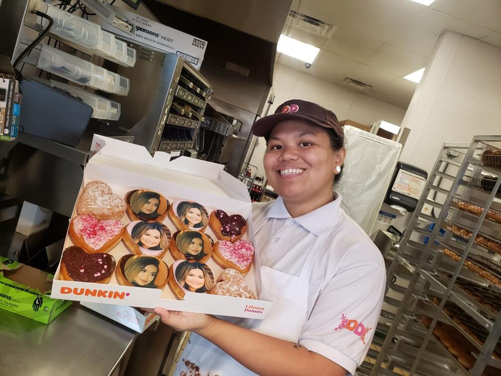 Employee with donuts